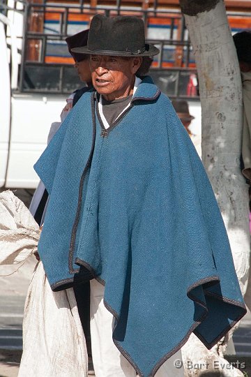 eDSC_0335.JPG - man in poncho on the market